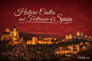 France's historic castle towers stand tall against a sunset skyline with orange and yellow hues.