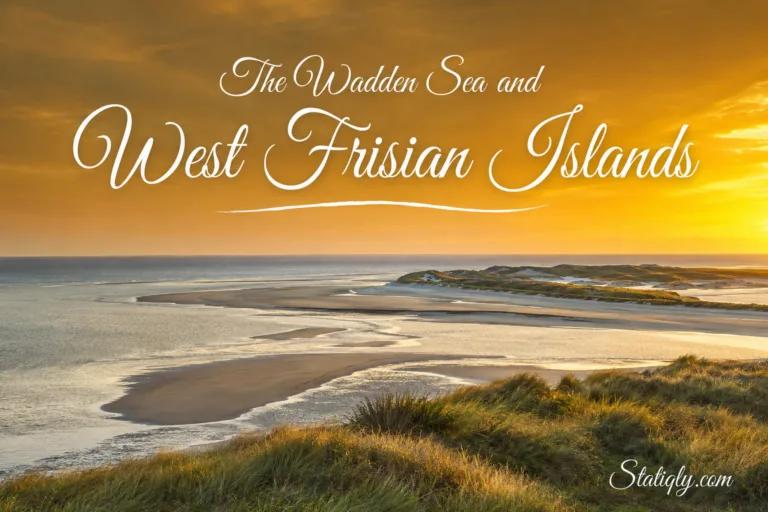 Scenic view of Wadden Sea and West Frisian Islands at sunset with sand dunes and calm waters.